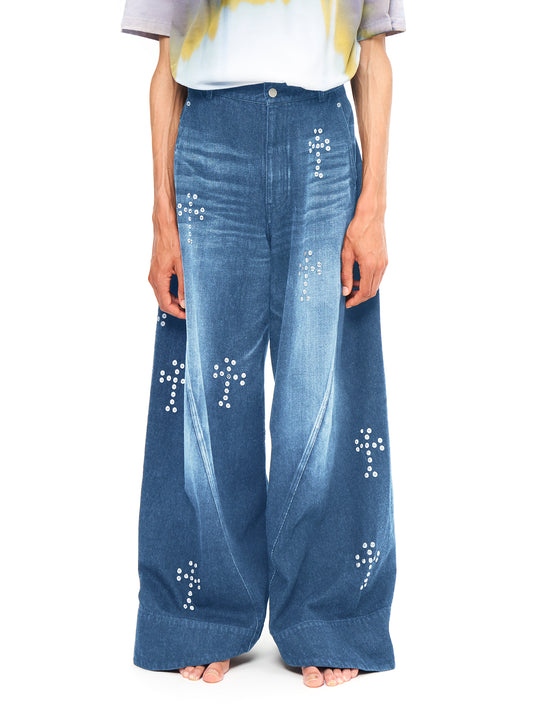 BAGGY TWISTED JEANS WITH CROSS RIVET INDIGO