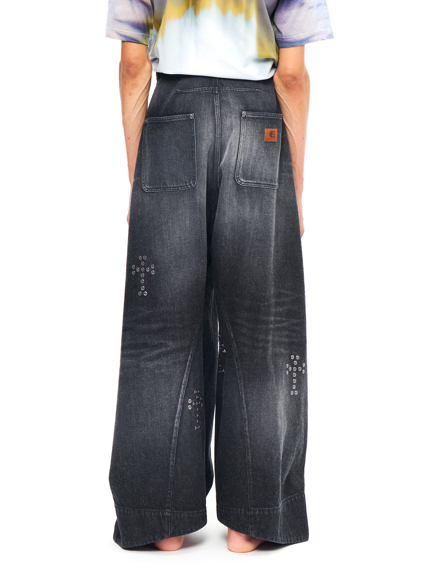 BAGGY TWISTED JEANS WITH CROSS RIVET BLACK