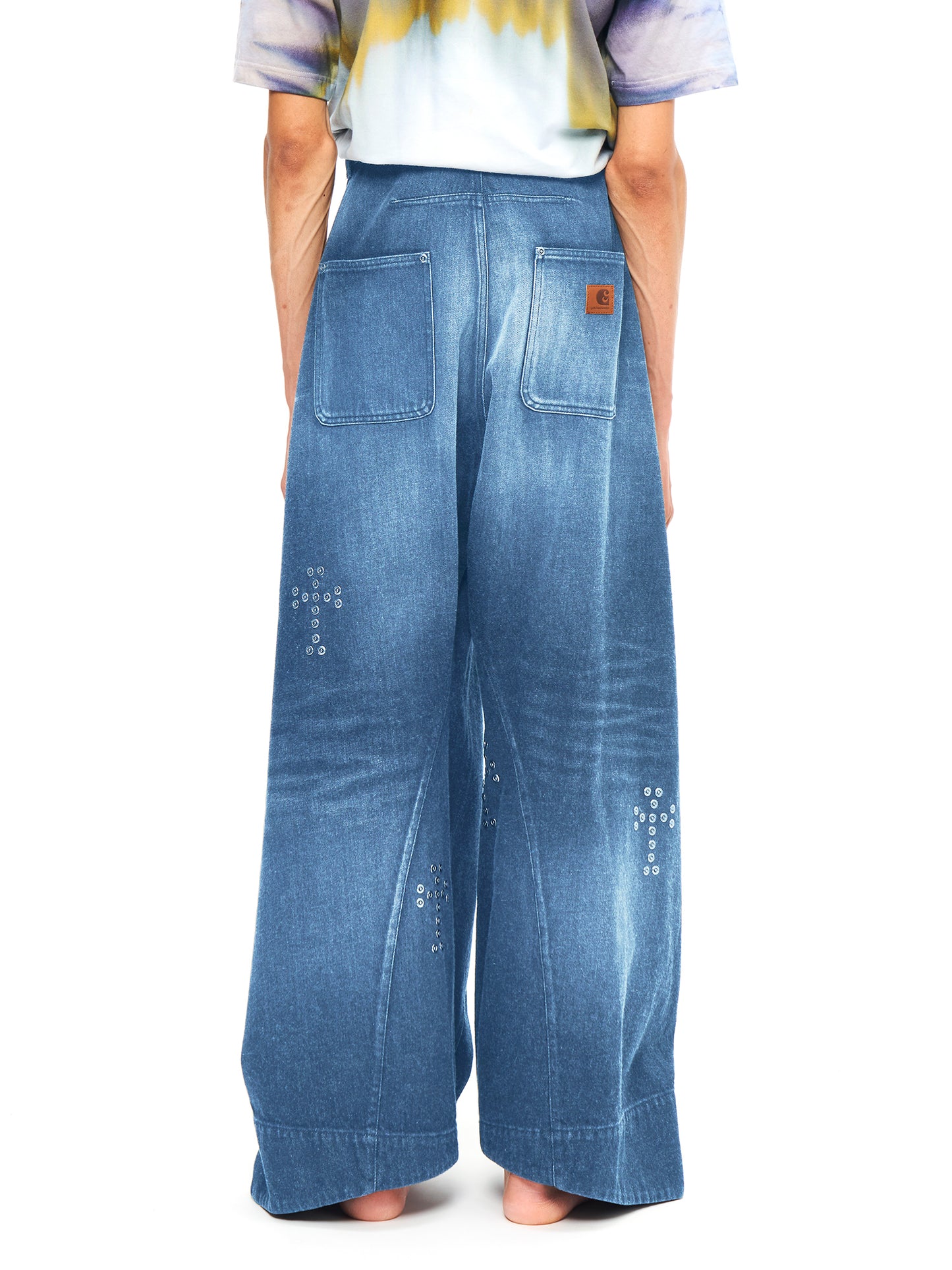 BAGGY TWISTED JEANS WITH CROSS RIVET INDIGO