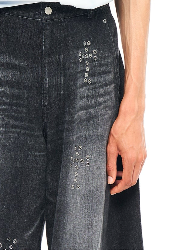 BAGGY TWISTED JEANS WITH CROSS RIVET BLACK